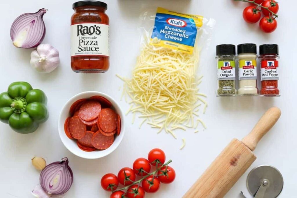 Ingredients needed to make canned biscuit pizza including biscuits, sauce, cheese, and pepperoni