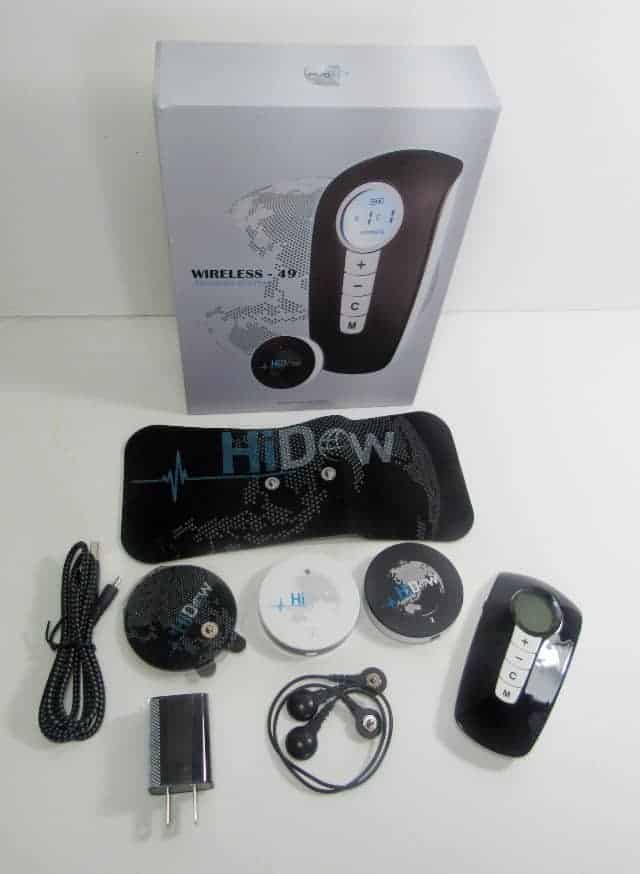 Wireless TENS unit kit with control device, electrode pads, charging cable, earbuds, and accessories displayed with product box.