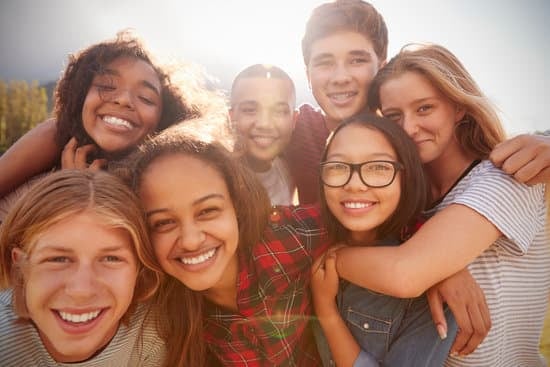 smiling teens posing for a selfie