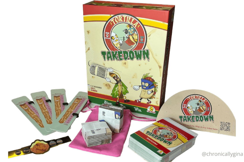 Tortilla Takedown card game with box, score trackers, and cards featuring fun taco and burrito characters, a hilarious family party game featured in a holiday gift guide by budget.