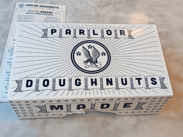 Parlor Doughnuts review feature image showing branded doughnut box on table at local shop