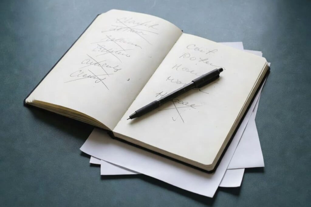 Journal prompts for overthinking with notebook and pen